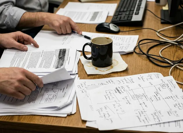 Documentary take on Editorial desk with notes and drafts concerning the reported ET/ED intervention